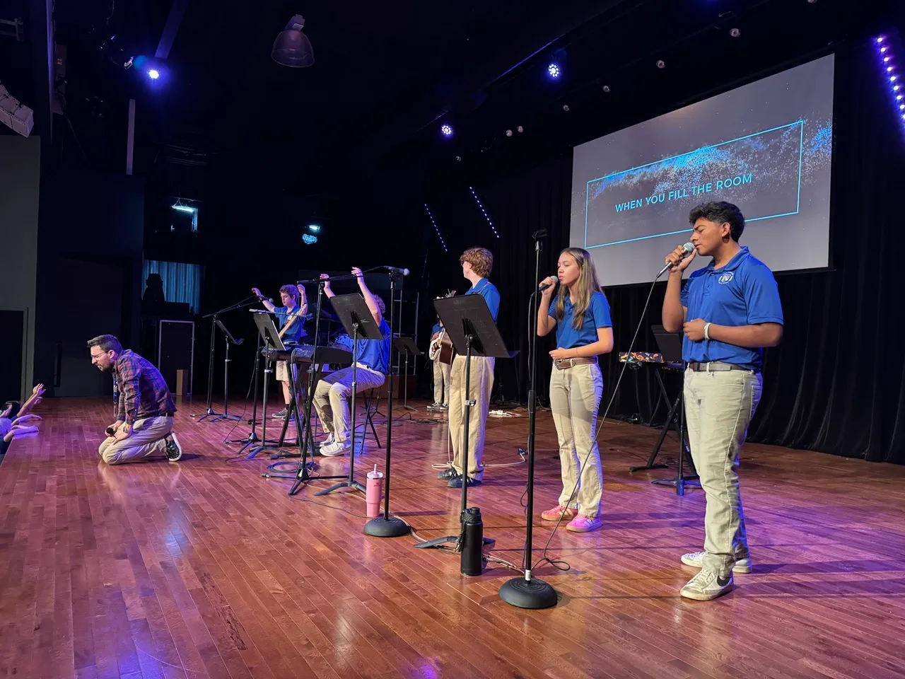 The Hill Country Christian School chapel band leading worship on stage
