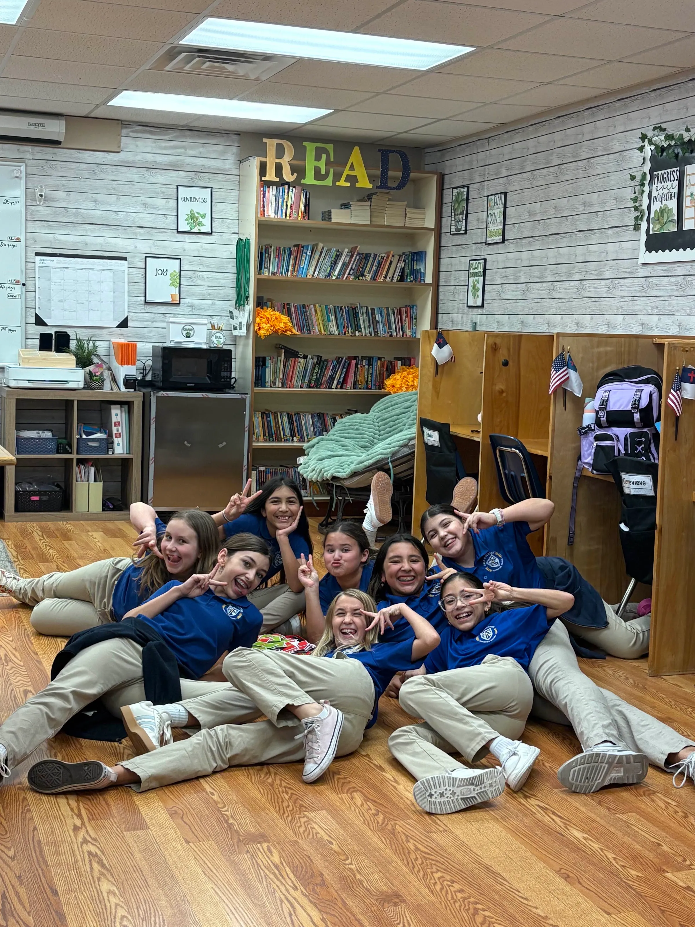 Middle school students reading together in the school library