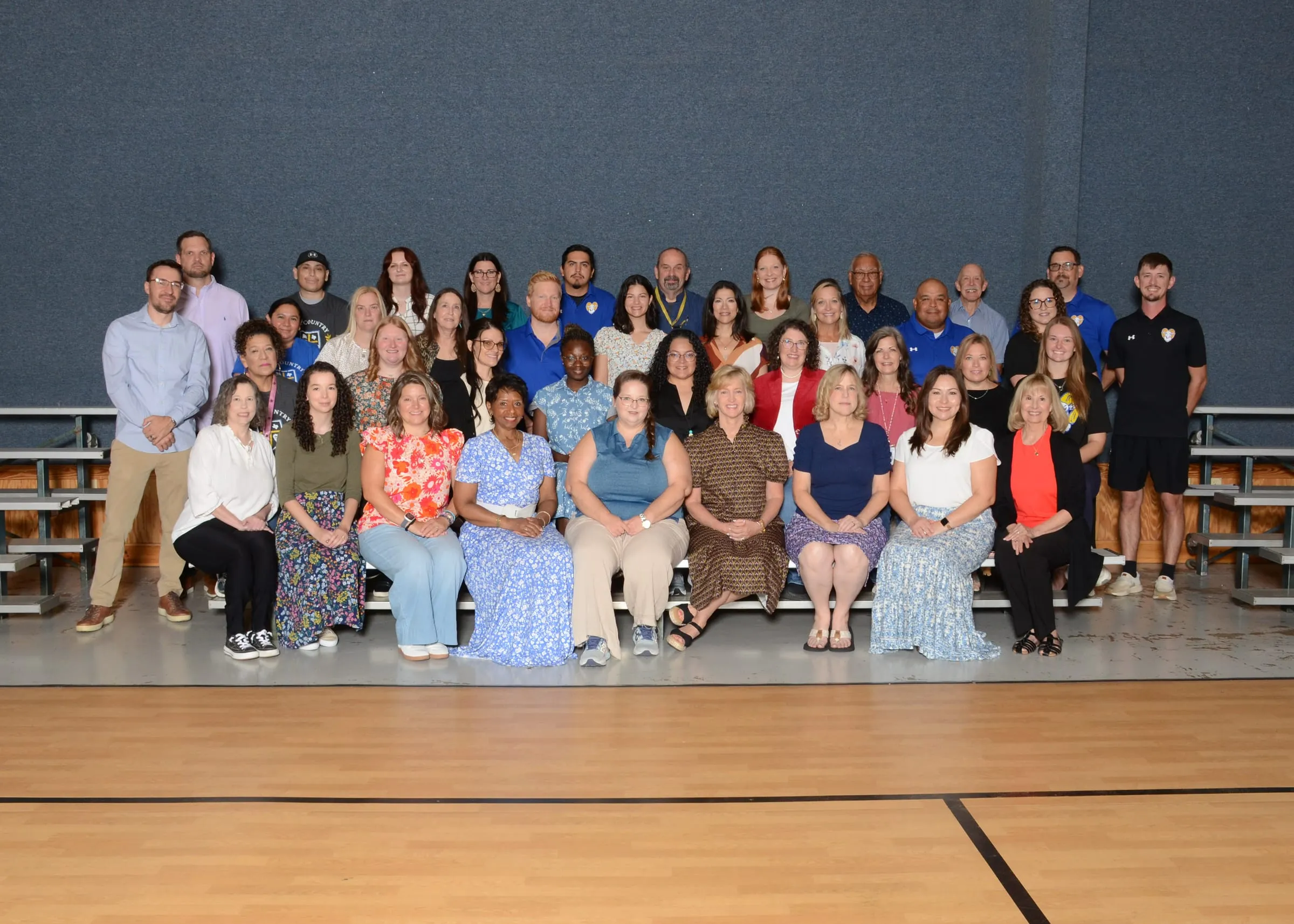 The Hill Country Christian School faculty and staff, photographed together in the school gym
